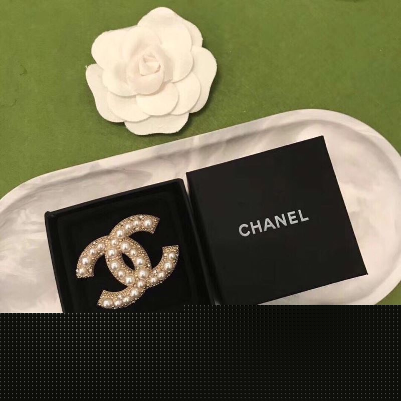 Ch*el brooches